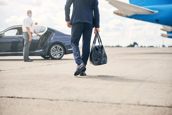 cropped-photo-successful-businessman-carrying-duffel-bag-headed-towards-taxi